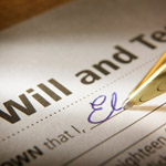 Photo of a will being signed 