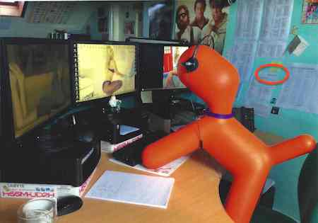 Dogbert looking at a computer screen